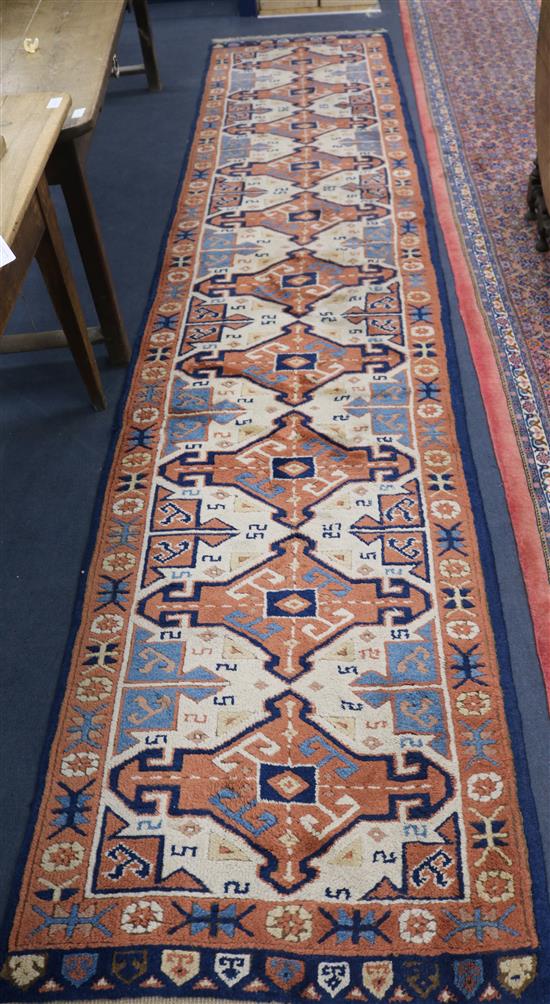 A blue and orange ground runner 420 x 87cm